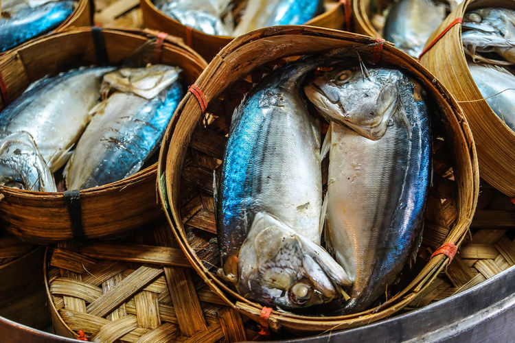 Thai traditional steamed mackerel fish in basket bamboo or wicker basket in thailand market.