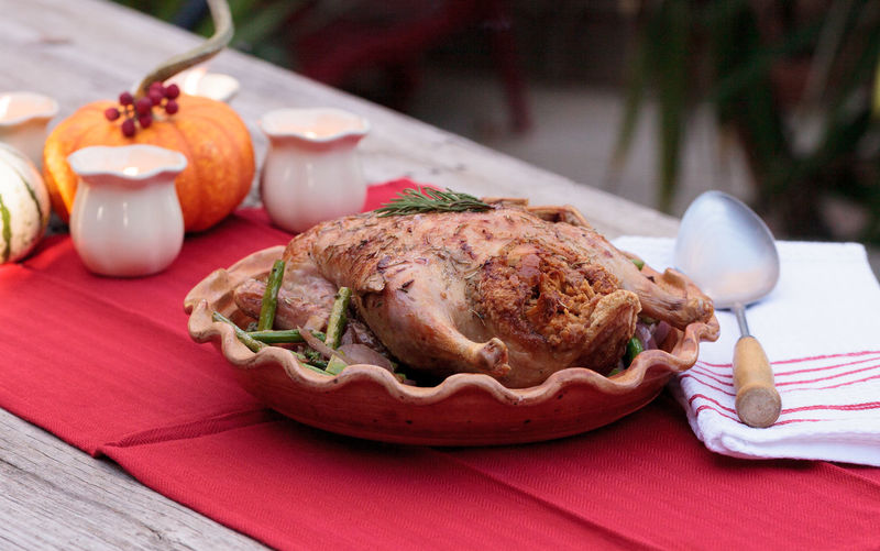 Roasted duck in plate on table