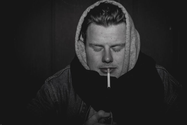 Close-up of man smoking cigarette