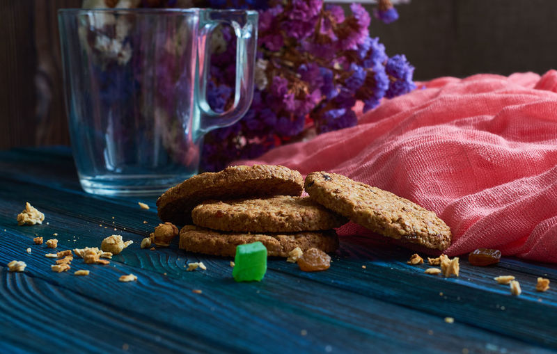 Close-up of cookies in glass on table