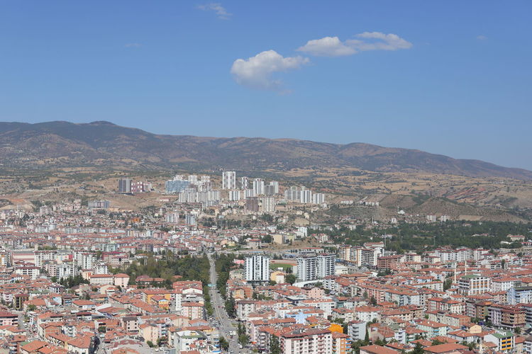 Aerial view of townscape against sky