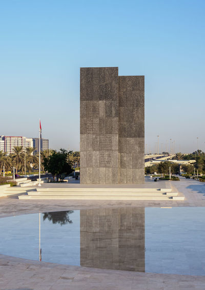 View of monument in city against clear sky