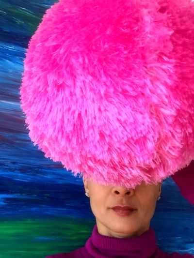Close-up of woman with pink water in sea