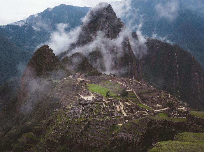 Aerial view of machu picchu ruins in foggy weather