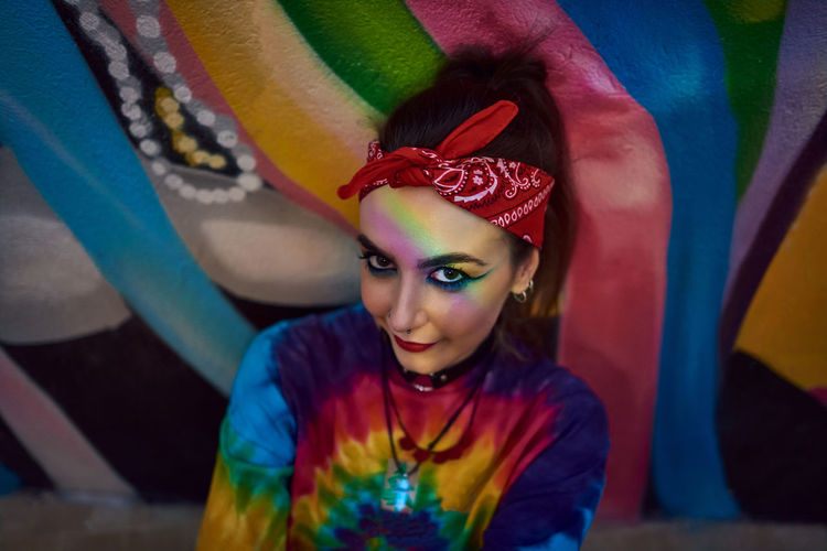 Young woman with urban style posing on the street.