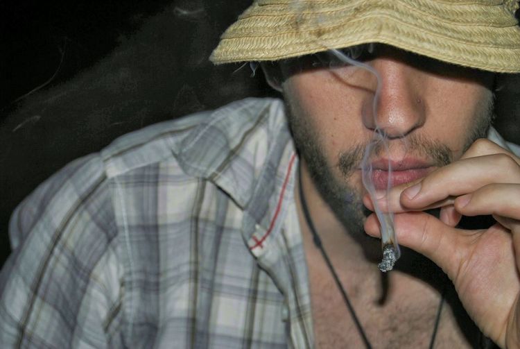 Close-up of man smoking marijuana