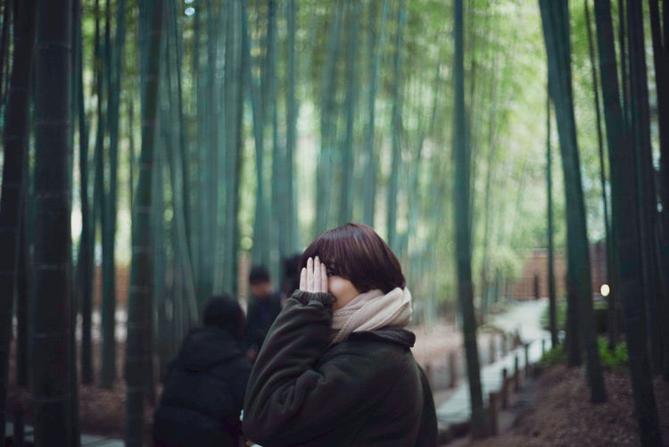 Rear view of a woman in a forest