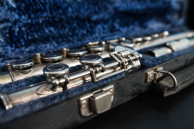 Close-up of musical instrument in blue container