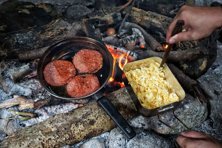Midsection of man preparing food