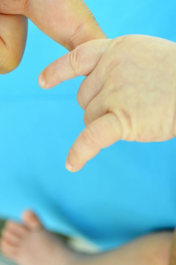 Close-up of hands holding baby