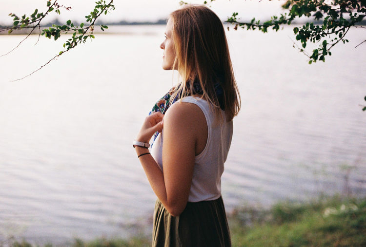 Side view of woman standing in water