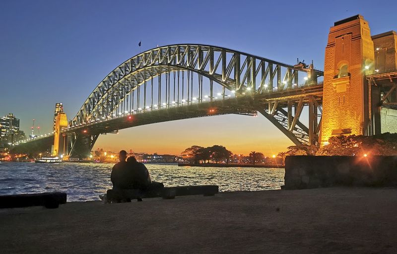Golden gate bridge over river during sunset