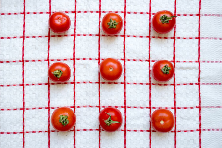 Directly above shot of tomatoes on tablecloth