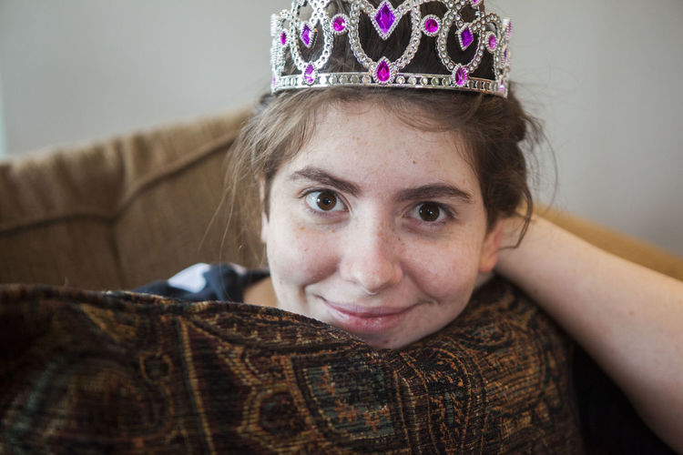 Portrait of smiling woman wearing crown