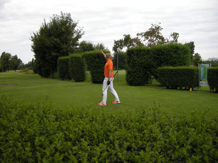 Man playing golf against sky