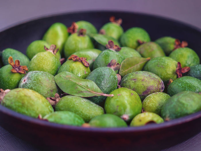 Close-up of green fruits in bowl