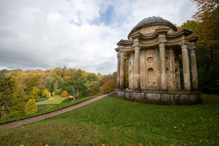 Autumn colours at stourhead can be viewed from the temple of apollo in stourhead gardens.