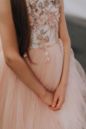 Details of a children's pink puffy organza dress