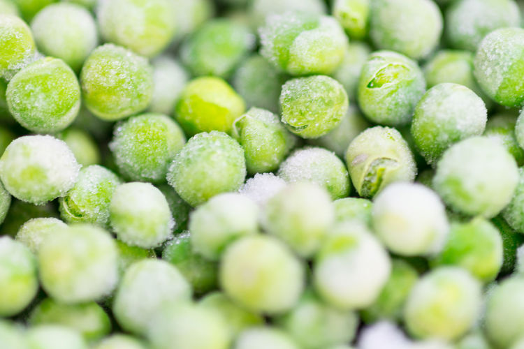 Full frame shot of frozen green peas