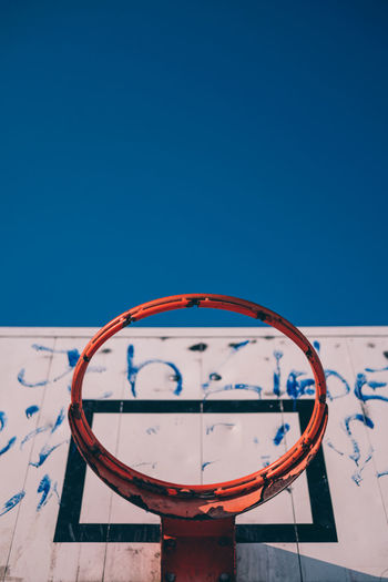 Close-up of basketball hoop against clear blue sky