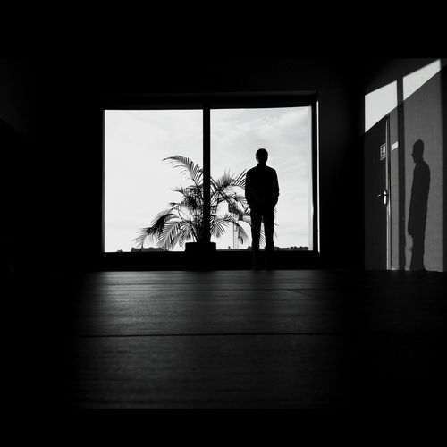 Silhouette woman in dark background