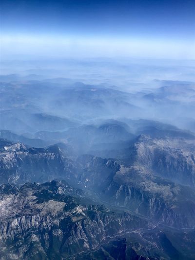 Aerial view of dramatic landscape against sky