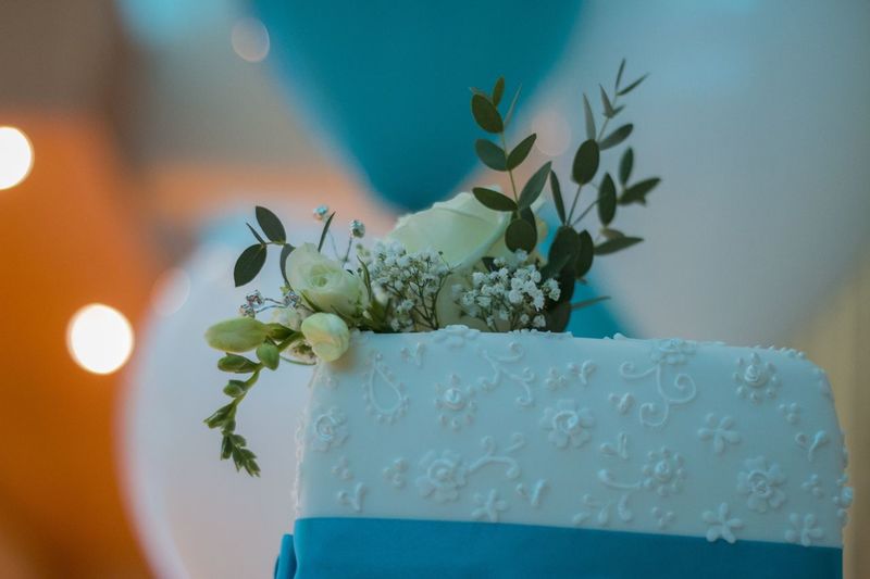 Close-up of flowers on wedding cake