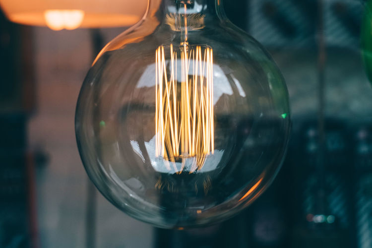 Close-up of illuminated light bulb