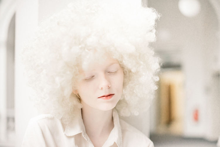 Adult Adults Only Afro Afrohair Beautiful People Beautiful Woman Beauty Blond Hair Close-up Contemplation Curly Hair Day Hamburg Headshot Human Body Part Indoors One Person Only Women People Portrait Warm Clothing White Color Winter Young Adult