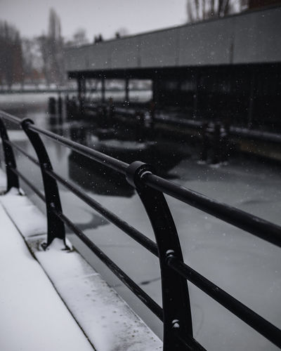 Snow on railing during rainy season