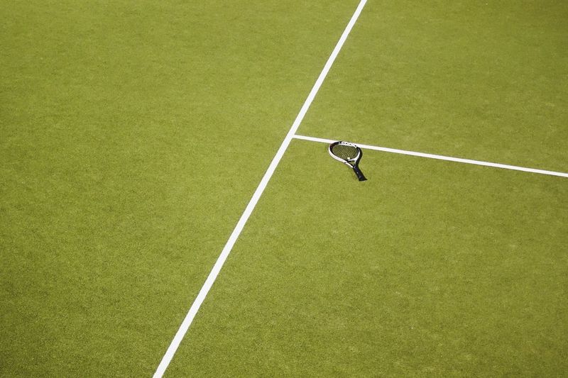 High angle view of tennis racket on court
