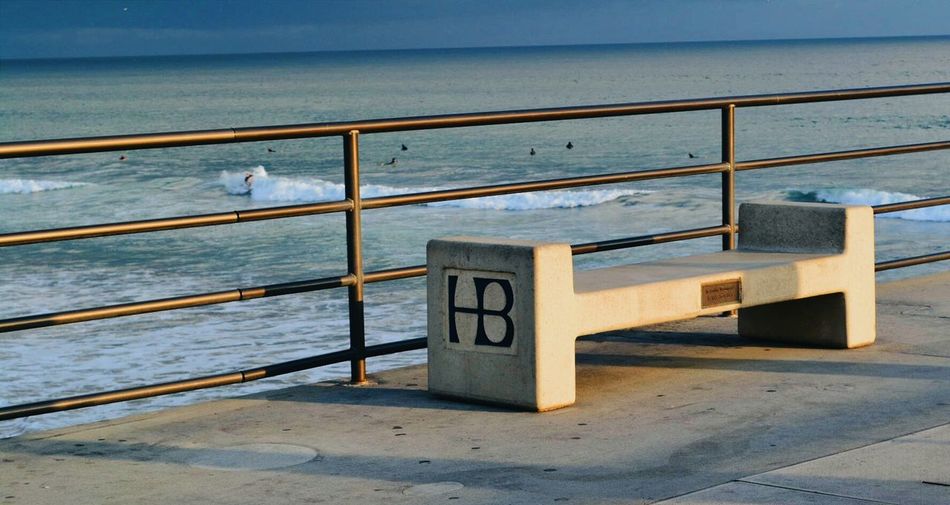 Empty wooden chairs in the sea