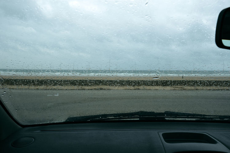 Raindrops on glass window of car