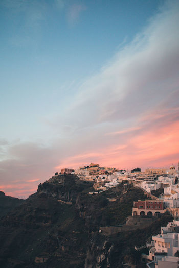 High angle view of townscape against sky during sunset fira, santorini 