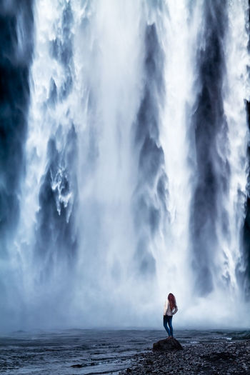 Woman at waterfall