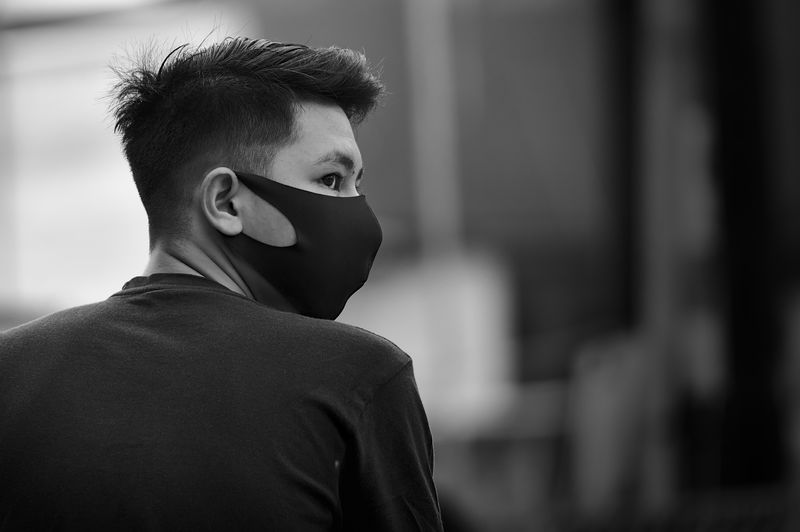 Portrait of young man looking away