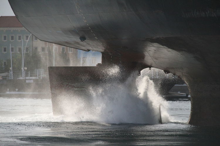 Water splashing by ship on river
