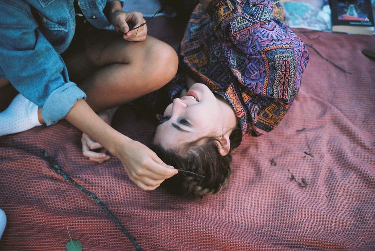 High angle view of friends on picnic blanket