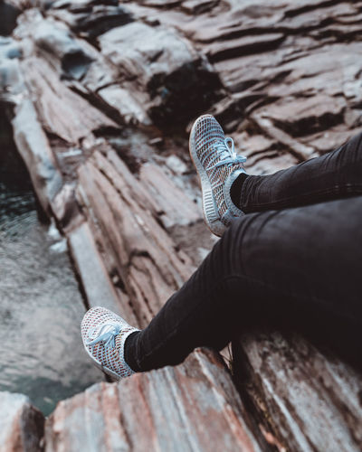 Low section of person on rock