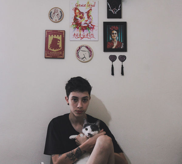 Portrait of woman with cat
