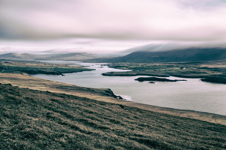 Scenic view of sea against cloudy sky