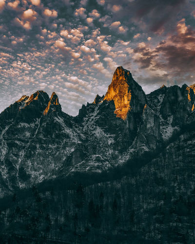 Scenic view of rocky mountains against sky during sunset