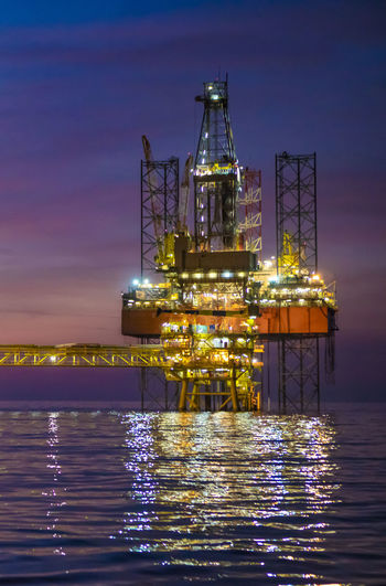 Offshore drilling jack up rig during dusk