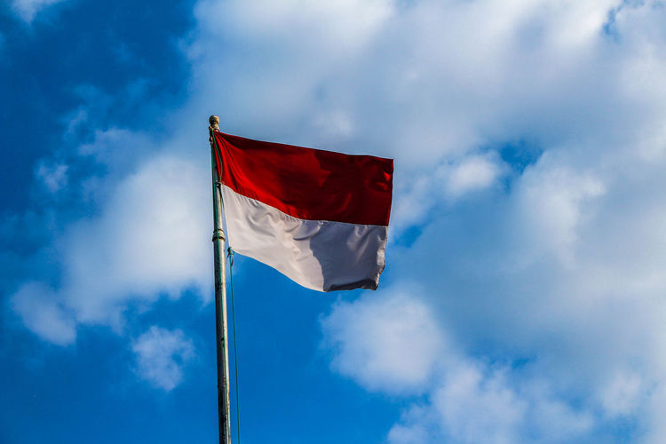 Low angle view of indonesian flag against sky
