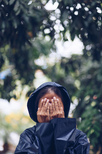 Woman covering face with hands