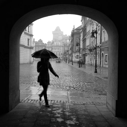 Woman standing in front of building