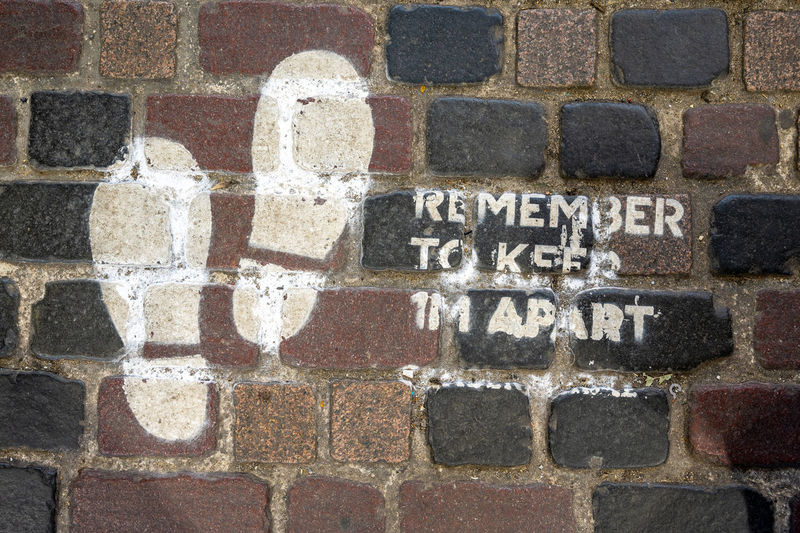 Close-up of text on brick wall