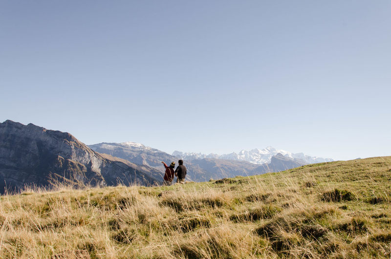 Verchaix, france, alps, hiking trail. french alps, young people on an adventure looking at view 