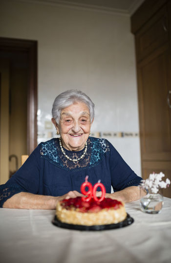 Portrait of happy senior woman celebrating her ninetieth birthday