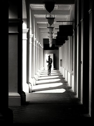 Full length of young man walking in corridor